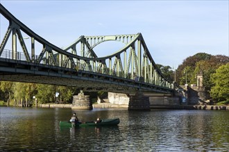 Anglers in a boat at the Glienicke Bridge in Potsdam. The Glienicke Bridge today forms the city