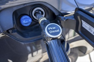 Diesel car is refuelled with diesel fuel, petrol station