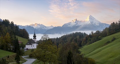 Maria Gern pilgrimage church at sunrise, behind Schönfeldspitze and the Watzmann, in autumn,