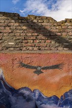 Colourful graffito with the image of an Andean condor (Vultur gryphus), street art in the city of