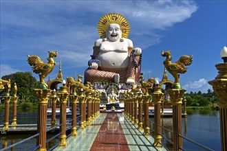 Laughing Buddha, larger-than-life statue in the Buddhist temple Wat Plai Laem, Koh Samui, Thailand,