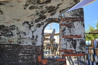 Weathered hull with propeller and defective stern rudder, Patmos Marine, boatyard, Diakofti,