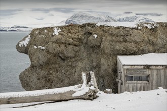 Driftwood and shed labelled County Jail, prison, Ny-Ålesund, Kongsfjord, Spitsbergen Island,