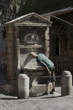 Public drinking water fountain in the historic centre of Rome, Italy, Europe