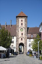 Pedestrian zone, shopping street with the Obertor, historic town gate of Villingen,