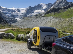 Mini caravan without standing height, swiss mini camper, Moiry glacier in the back, Valais,