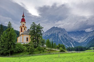 Baroque Roman Catholic parish church of St Nicholas, listed building, mountains of the Stubai Alps,