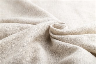 Fragment of white linen tissue. Side view, natural textile background and texture. wave concept,