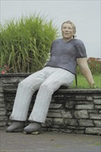 Sculpture Holger by Christel Lechner 2021, figure, man, sitting, wall, everyday people,