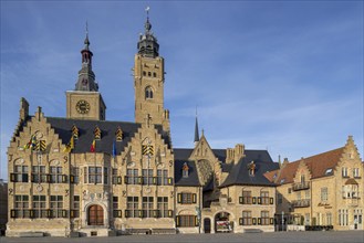 Market square showing town hall with belfy and St Nicholas Church tower, rebuilt after WWI in the