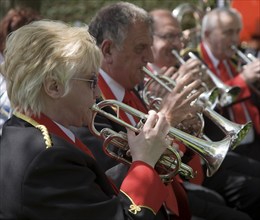 Musicians in a brass band perform during a country fair at Helmingham Hall, Suffolk, England,