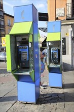 Telephone kiosk boxes in street, La Latina, Madrid city centre, Spain, Europe