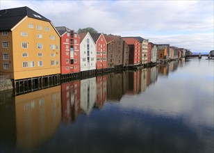 Historic waterside warehouse buildings on River Nidelva, Bryggene, Trondheim, Norway, Europe