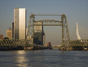 Early morning sunshine on the River Maas and de Hef railway bridge, Koningshaven, Rotterdam,