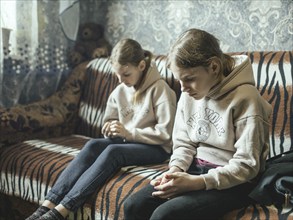 Sveta and Ira in their family home in Voloska Balakliia. The village is close to the front line,