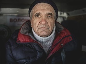 Vasily in the minibus of the team of volunteers evacuating him, being taken from Kupyansk to