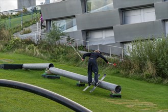 CopenHill, waste incineration plant and artificial ski slope, skiing with a view of the ski lift,