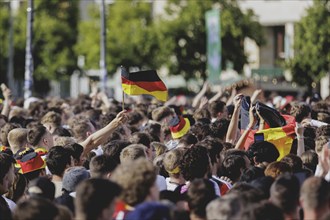 Fans react during the European Championship preliminary round match between Germany and Hungary on