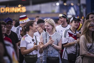 Scenes in the fan zone on Platz der Republik in front of the Reichstag building taken in Berlin, 29