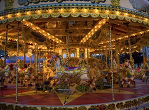 Fairground carousel ride with horses and no people, Weymouth, Dorset, England, United Kingdom,