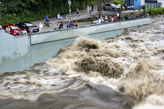 Weir of the Lake Baldeney in Essen, the masses of water roar through the open weirs, spectators,