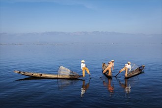 Myanmar travel attraction landmark, Traditional Burmese fishermen with fishing nets on boats at