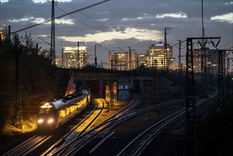 Skyline of Essen city centre, railway facilities in front of the main station, regional train,