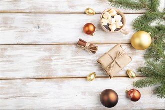 Christmas or New Year composition. Decorations, box, golden balls, cinnamon, fir and spruce