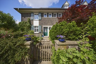 House with entrance and garden gate in the Margarethenhöhe estate, Essen, Ruhr area, independent