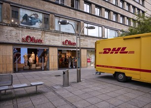 DHL delivery vehicle, logo, parked in front of s.Oliver department stores' chain, pedestrian zone,