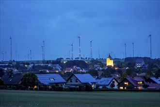 Wind farm above the village of Lichtenau, self-proclaimed energy town, houses with photovoltaic