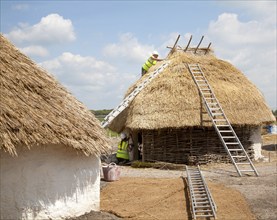 Buildings of replica Neolithic huts at the Stonehenge site, Wiltshire, England, UK