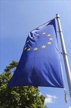 Flag of the European Union in front of a blue sky