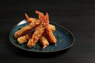 Fried shrimp, peeled in tempura, soy sauce, close-up