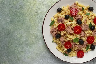 Tuna salad, fusilli pasta, olives and cherry, olive oil, homemade