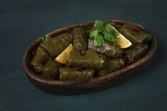 Dolma (Tolma) stuffed rolls, minced meat with rice, in grape leaves, top view, no people, close-up