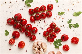 Baked branch, mini, cherry tomatoes, with spices and herbs, garlic, food background, top view, on a