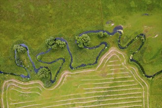 Aerial view over meander belt in meandering Klingavälsån river, tributary to Kävlingeån in the