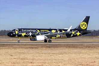 A Eurowings Airbus A320 aircraft with the registration D-AEWM and the Borussia Dortmund special