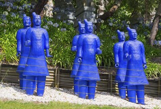 A group of blue terracotta warrior statues surrounded by plants and trees, Bacalhôa, Bacalhoa