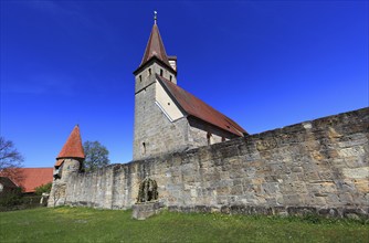 Small Easter fountain in front of the fortified church from the Middle Ages, fortified church,