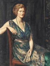 A woman in elegant dress sits in an armchair and holds a fan. portrait of a lady, thought to be Mrs