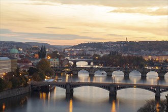 Prague at sunset with the most beautiful view of the Vltava River with its bridges and the