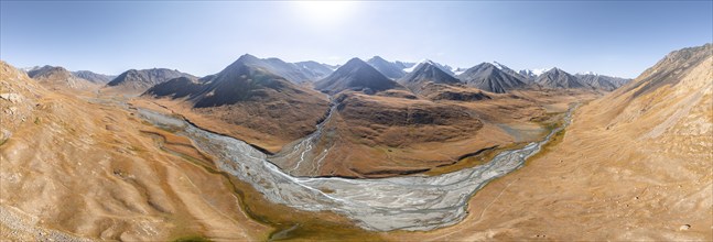 Aerial view, Burkhan mountain valley with meandering river, barren dramatic mountain landscape,