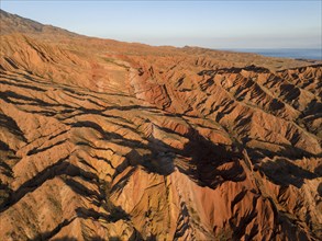 Aerial view, eroded mountain landscape, sandstone cliffs, canyon with red and orange rock