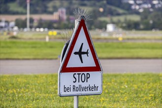 Traffic sign Stop at taxiing traffic, prohibition sign with aeroplane, Zurich Airport, Switzerland,