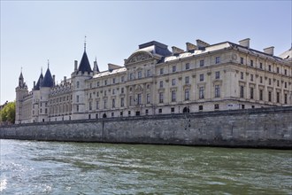 Impression of a castle on the banks of the Seine with historic architecture against a clear sky,