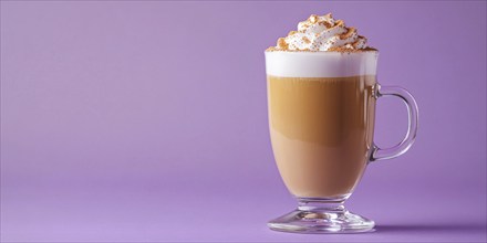 Banner with glass with seasonal pumpkin spice latte on violet background with copy space.