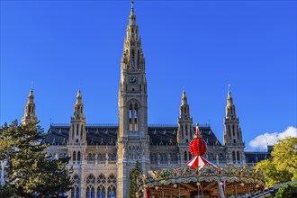 Children's carousel at the Christmas market at the town hall, behind the town hall, Vienna,