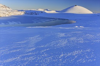 Morning light on a snowy lava field, lake, volcanic crater, snow, winter, Berserkjahraun,